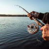 hands man urp plan hold fishing rod fisherman catches fish dawn fishing hobby vacation 99433 2581 1