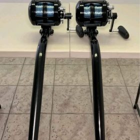 Two black Avet 50 Wide Seeker Rail Boss 2-piece bent butt rods with Winthrop roller tips